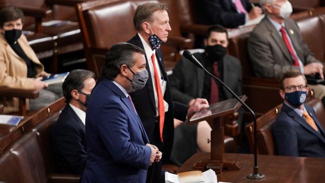 Sen. Ted Cruz (L) seconds the objection to Arizona's Electoral College certification from the 2020 presidential election during a joint session of Congress at the US Capitol in Washington.