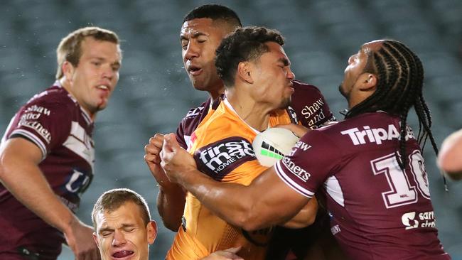 GOSFORD, AUSTRALIA - JUNE 11: Xavier Coates of the Broncos is tackled during the round five NRL match between the Manly Sea Eagles and the Brisbane Broncos at Central Coast Stadium on June 11, 2020 in Gosford, Australia. (Photo by Cameron Spencer/Getty Images)