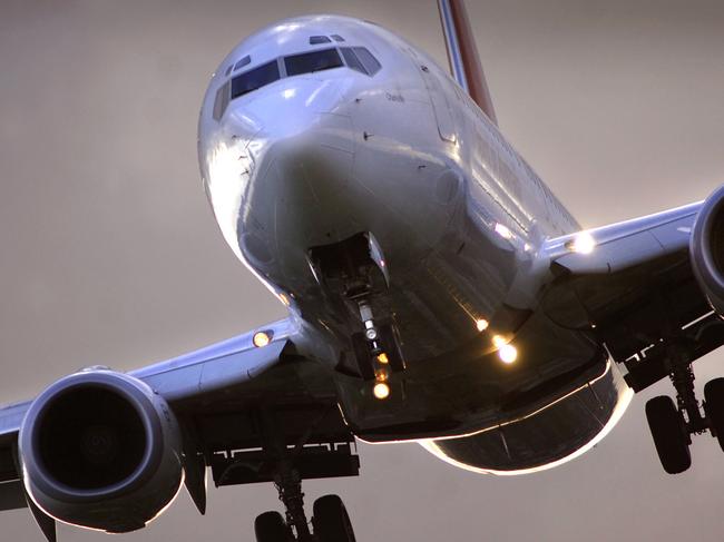 A Qantas Airways Ltd. plane takes off from Sydney's Kingsford Smith Airport in Sydney, Australia, on Thursday, January 4, 2007. Photographer: Jack Atley/Bloomberg News