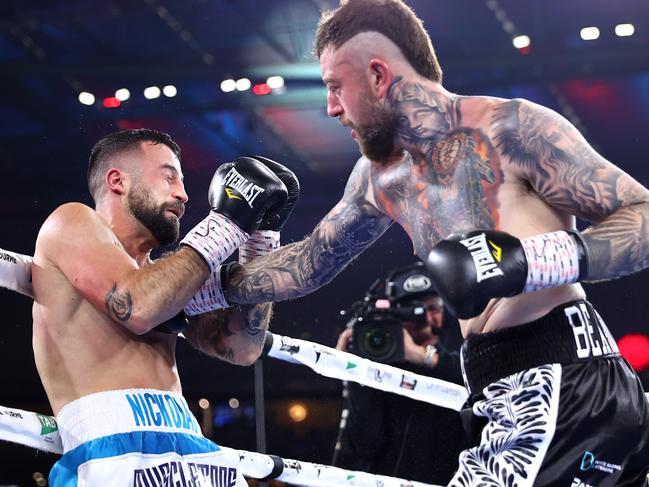 Terry Nickolas (L) scrapes a draw against Lachlan Higgins. Photo by Mikey Williams/Top Rank Inc via Getty Images