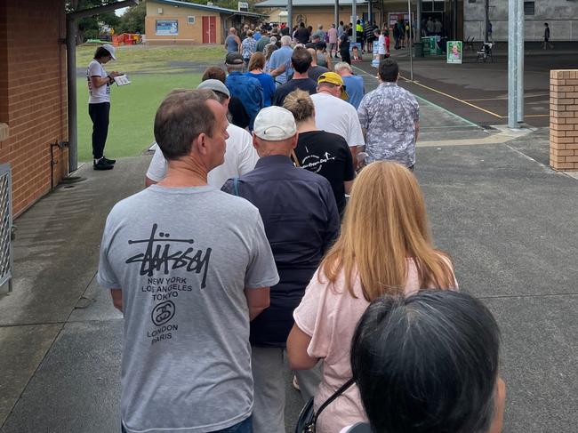 Voters queue up at The Entrance Public School to vote in the 2023 NSW State Election in the electorate of The Entrance. Picture: Richard Noone