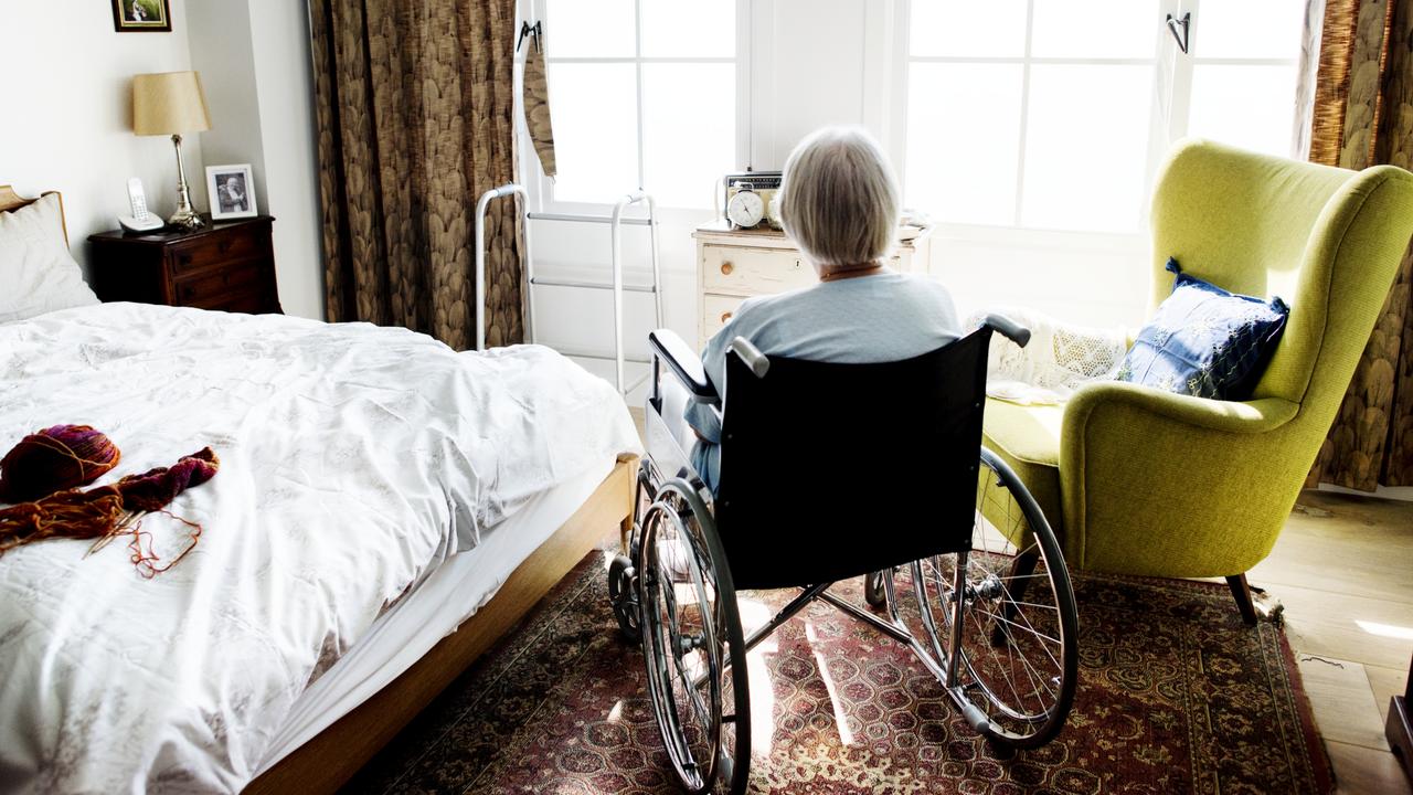 Elderly woman sitting in her wheelchair alone.