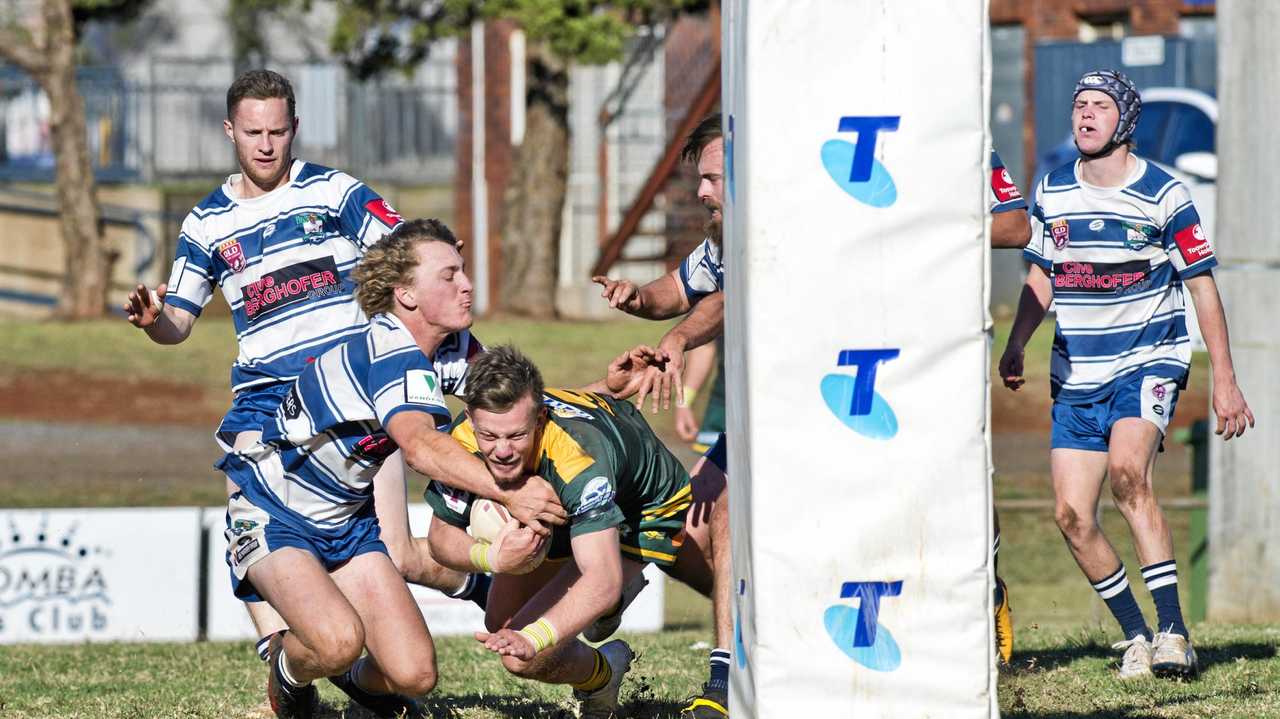 TRY TIME: Nicholas Van Der Poel scores for Wattles in his side's win over Brothers yesterday. Picture: Nev Madsen