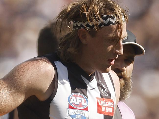 MELBOURNE, AUSTRALIA - SEPTEMBER 30: Nathan Murphy of the Magpies leaves the field with trainers during the 2023 AFL Grand Final match between Collingwood Magpies and Brisbane Lions at Melbourne Cricket Ground, on September 30, 2023, in Melbourne, Australia. (Photo by Daniel Pockett/AFL Photos/via Getty Images)