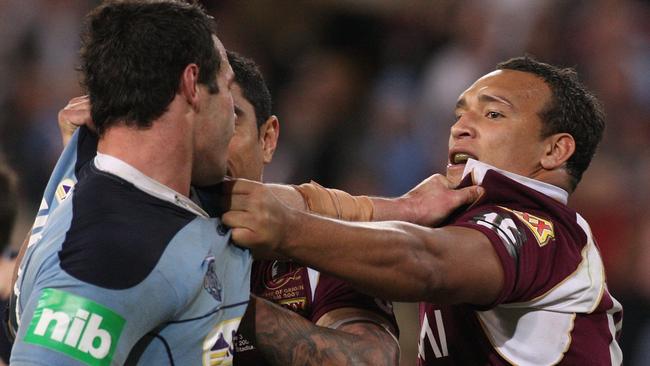 Neville Costigan of the Maroons clashes with Brett White of the Blues during game three of the 2009 State of Origin series. Photo: Jonathan Wood/Getty Images