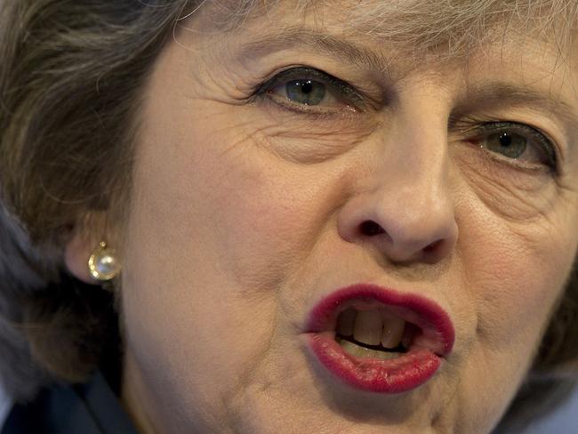 TOPSHOT - British Prime Minister Theresa May addresses delegates at the annual Confederation of British Industry (CBI) conference in central London, on November 21, 2016. The British government announced fresh investment in research and development on Monday, ahead of the first post-Brexit budget which is expected to signal a move away from the previous administration's rigid fiscal targets. / AFP PHOTO / Justin TALLIS