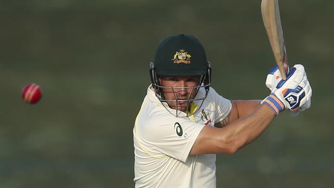 Australia's Aaron Finch plays a shot against Pakistan during their test match in Abu Dhabi, United Arab Emirates, Thuresday, Oct. 18, 2018. (AP Photo/Kamran Jebreili)