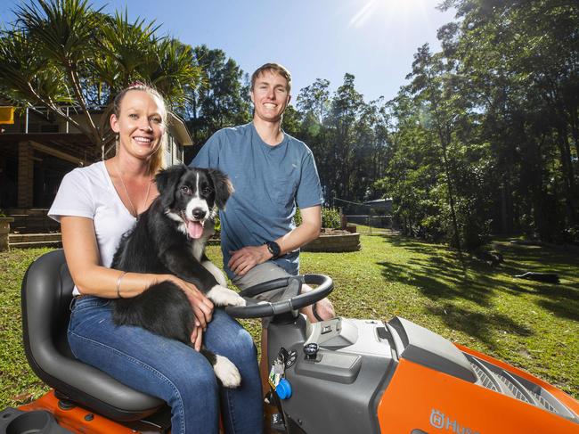 Tegan Madden 26 with partner James Widdicombe 28, and puppy Ace, who recently purchased an acreage at Pomona in the Noosa Hinterland, and have enjoyed the time in isolation getting jobs done around the block. Photo Lachie Millard