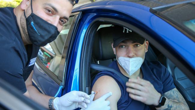 Nick Cotric does his bit for the vaccination drive.