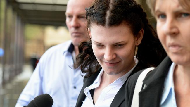 Shelby Lee Angie Holmes, centre, outside the District Court in September. Picture: Picture Greg Higgs