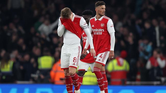 Martin Odegaard and Ben White of Arsenal look dejected after conceding their side's third goal. (Photo by Julian Finney/Getty Images)