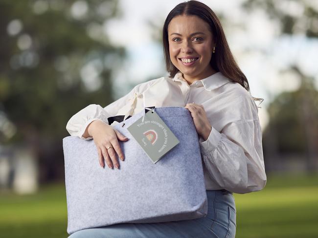 Founder, Stephanie Malan in Clarence Park, with a care bag from The Village Co. for vulnerable mums, Thursday, May 23, 2024. Picture: Matt Loxton