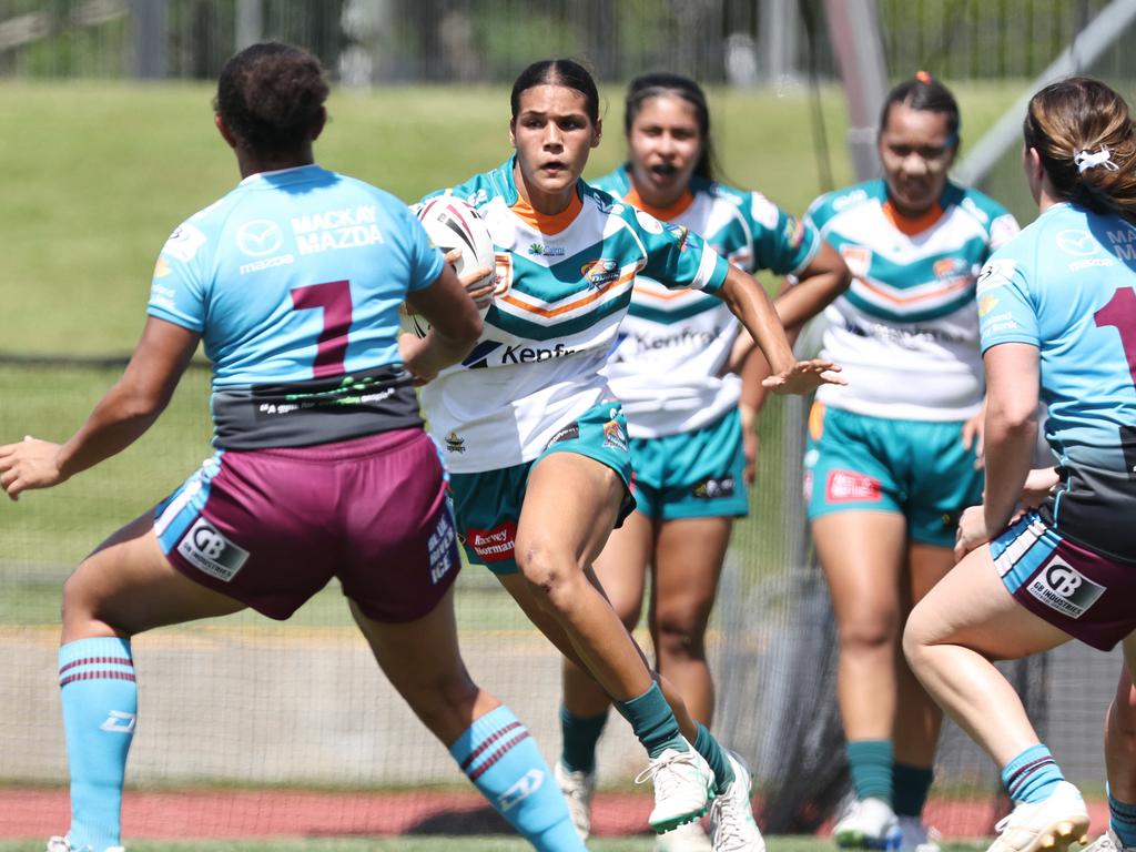 Jordana Woods fends off Cutters' Jaccoa Keyssecker in the Queensland Rugby League (QRL) Under 19 Women's match between the Northern Pride and the Mackay Cutters, held at Barlow Park. Picture: Brendan Radke