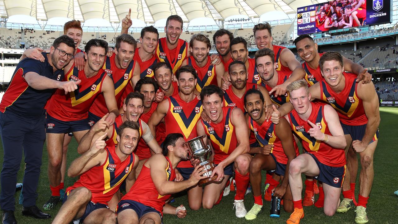 PERTH, AUSTRALIA - MAY 12: The SANFL team pose with the Haydn Bunton Jnr Cup after winning the state game between WA and SA at Optus Stadium on May 12, 2019 in Perth, Australia. (Photo by Paul Kane/Getty Images)