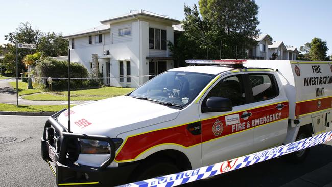 Police and Queensland Fire and Emergency Services investigate at a home in Coomera after emergency services were called to a house fire and a manÃ•s body was found inside. Picture: Tertius Pickard