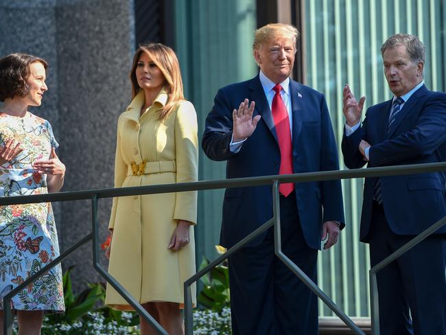 US President Donald Trump on the balcony with wife Melania, Finnish President Sauli Niinisto and his wife Jenni Haukio at the Presidential Palace in Helsinki.