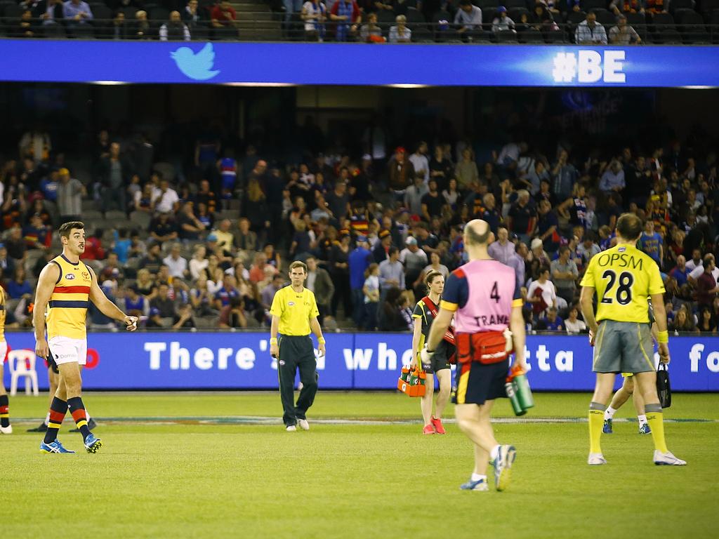 Adelaide captain Taylor Walker talks to Pannell at three quarter time of the game in which he awarded the Bulldogs 17 free kicks and the Crows one. Picture: Wayne Ludbey