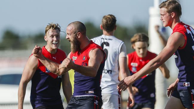 Daniel Gormley (second from left) celebrates a goal for Mt Eliza.