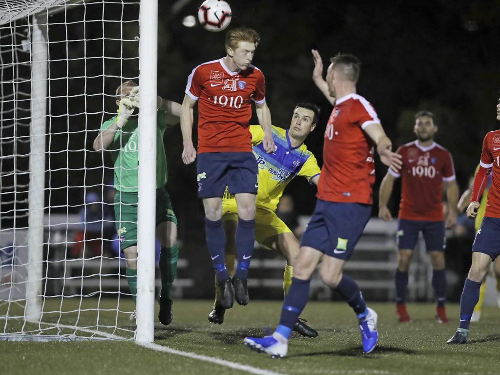 Lokoseljac Cup Final at KGV. Devonport Strikers versus South Hobart. South Hobart's Adam Gorrie defends a corner in the air. Picture: PATRICK GEE