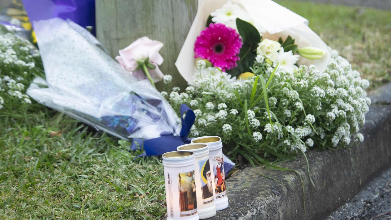 Three candles placed at the scene. Picture: NewsWire / Jeremy Piper