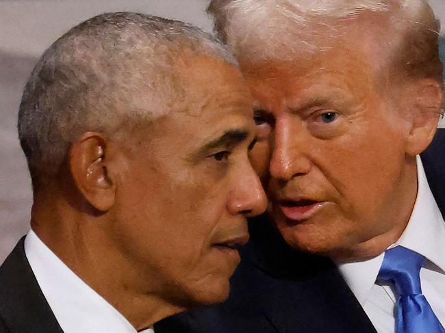 WASHINGTON, DC - JANUARY 09: Former U.S. President Barack Obama (L) and U.S. President-elect Donald Trump visit while attending the state funeral for former U.S. President Jimmy Carter with former first lady Melania Trump, Vice President Kamala Harris and second gentleman Doug Emhoff at Washington National Cathedral on January 09, 2025 in Washington, DC. President Joe Biden declared today a national day of mourning for Carter, the 39th President of the United States, who died at the age of 100 on December 29, 2024 at his home in Plains, Georgia.   Chip Somodevilla/Getty Images/AFP (Photo by CHIP SOMODEVILLA / GETTY IMAGES NORTH AMERICA / Getty Images via AFP)