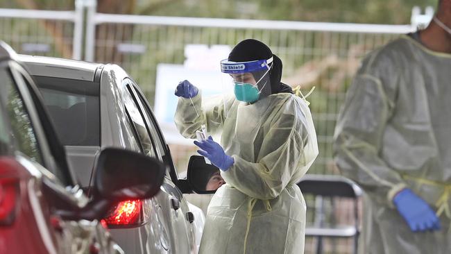 People get tested at a drive through COVID-19 site in Carlingford, where a local cluster has grown from infected students at Tangara Girls High School in Cherrybrook. Picture: Richard Dobson