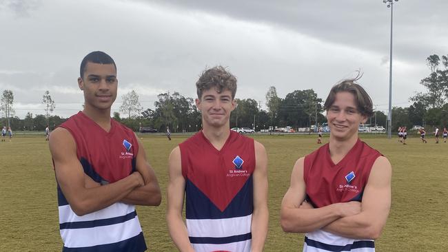 St Andrew's Anglican College senior boys players Jacob Hughes, Jaxon Woodward and Jesh Morgan get ready for a day of play in the AFLQ Secondary Schools Cup.