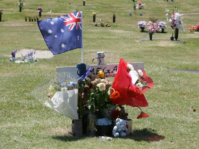 The grave of Omega Ruston one year after his murder.