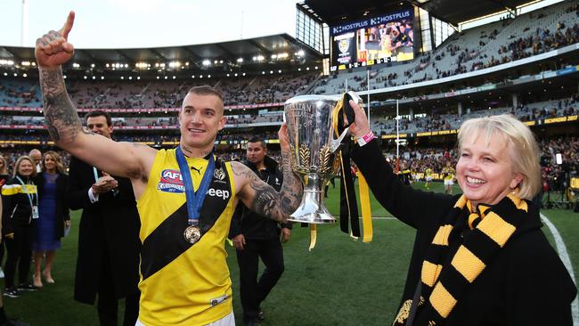 Dustin Martin and President Peggy O'Neal celebrates the 2017 flag. Picture: Phil Hillyard