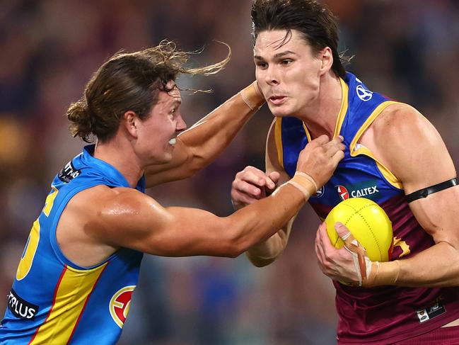 BRISBANE, AUSTRALIA - MAY 05: Eric Hipwood of the Lions is tackled during the round eight AFL match between Brisbane Lions and Gold Coast Suns at The Gabba, on May 05, 2024, in Brisbane, Australia. (Photo by Chris Hyde/AFL Photos/via Getty Images )