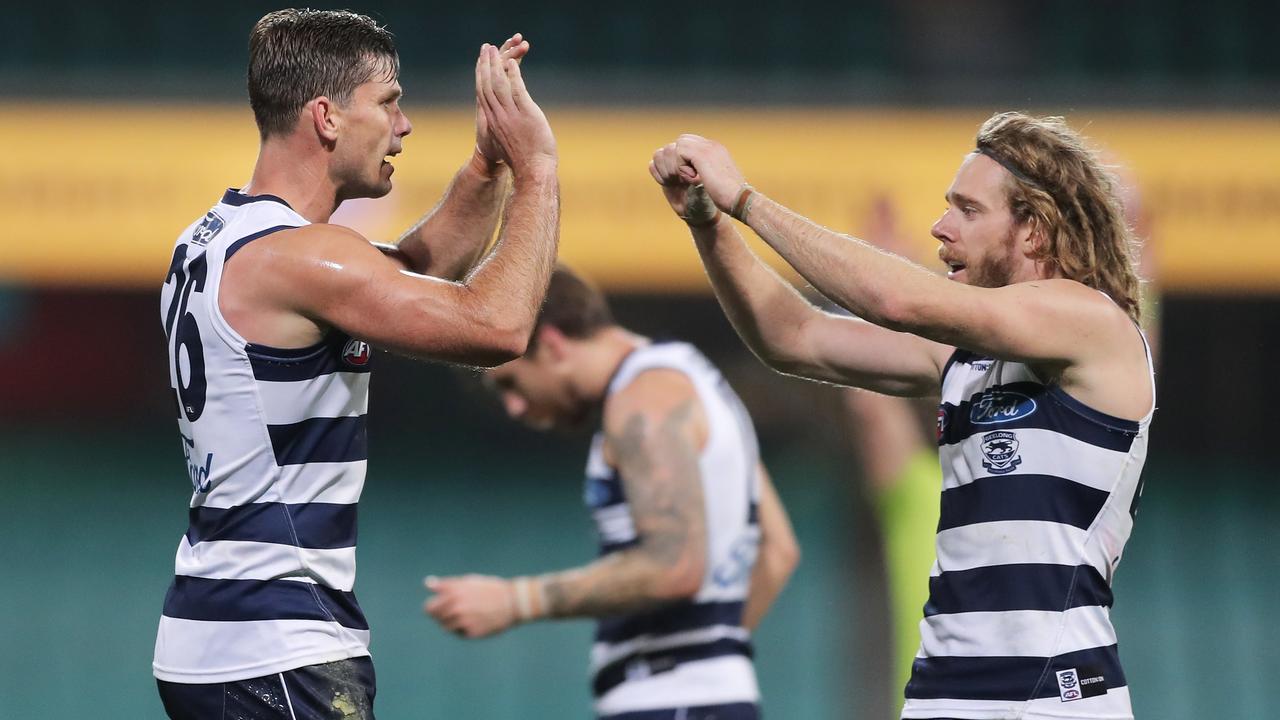 SYDNEY, AUSTRALIA - JULY 09: Tom Hawkins of the Cats (L) celebrates victory with Cameron Guthrie (R) after the round 6 AFL match between the Geelong Cats and the Brisbane Lions at Sydney Cricket Ground on July 09, 2020 in Sydney, Australia. (Photo by Matt King/AFL Photos/via Getty Images)