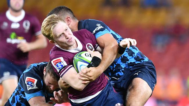 Isaac Lucas (centre) of the Reds in action during the Round 7 Super Rugby match between the Queensland Reds and the Bulls at Suncorp Stadium in Brisbane, Saturday, March 14, 2020. (AAP Image/Darren England)