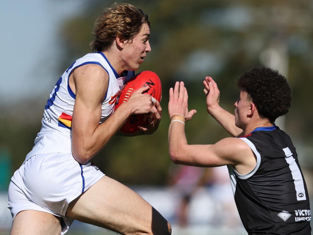 Iliro Smit takes on a tackler. Picture: Scott Sidley/AFL Photos