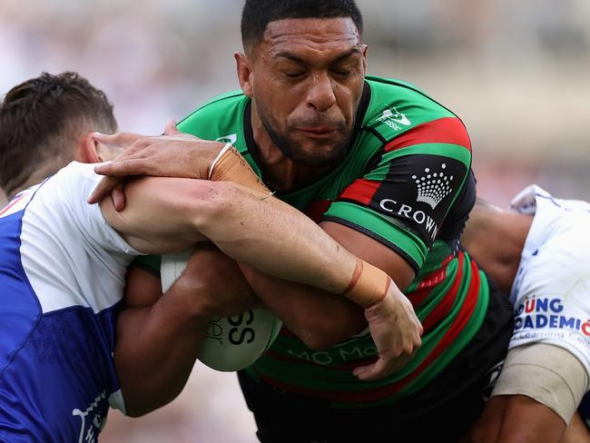 SYDNEY, AUSTRALIA - APRIL 15: Taane Milne of the Rabbitohs is tackled during the round six NRL match between the South Sydney Rabbitohs and the Canterbury Bulldogs at Stadium Australia, on April 15, 2022, in Sydney, Australia. (Photo by Cameron Spencer/Getty Images)