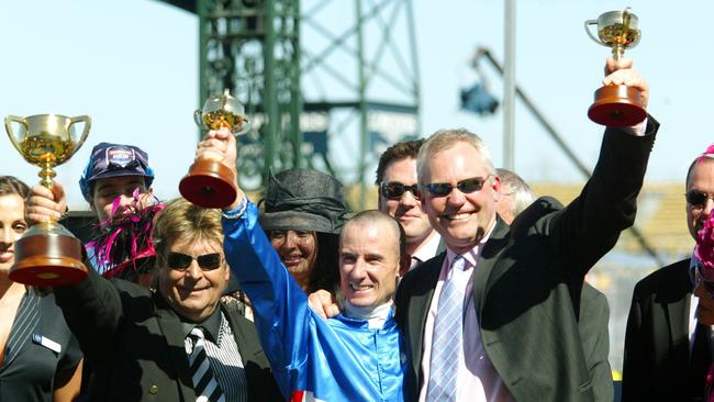 Where the legend began: Tony Santic, Glen Boss and David Hall celebrate after the 2003 Melbourne Cup.