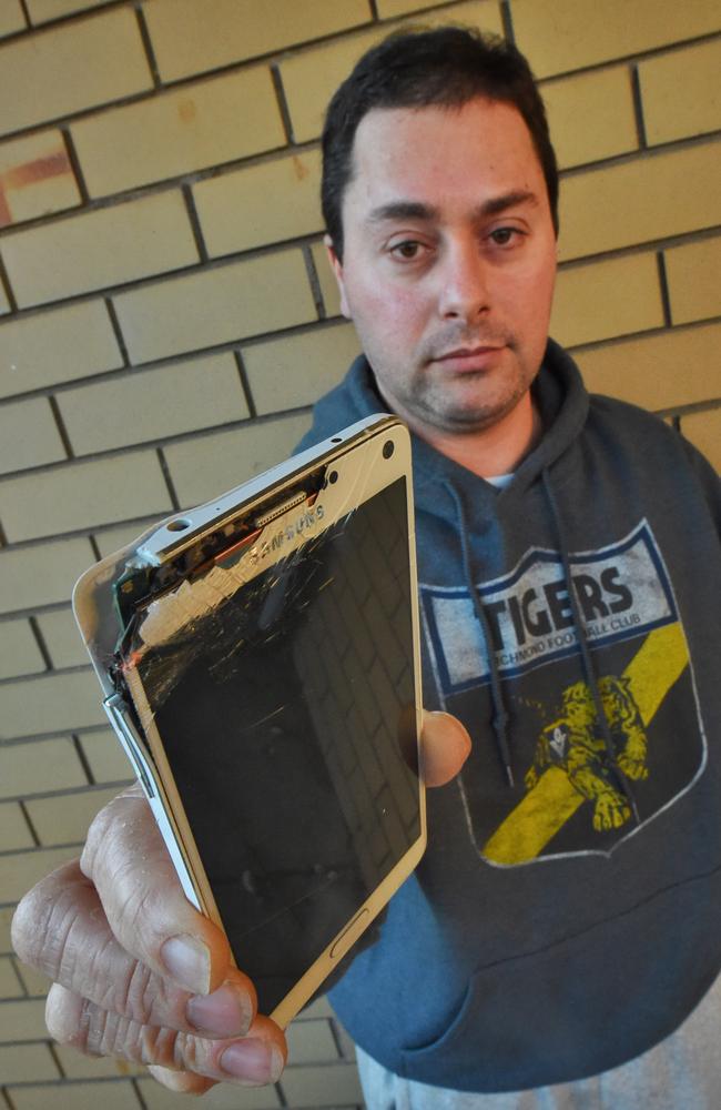 Richmond fan George Kalogiannis says he was bashed by security while trying to film supporters being kicked out of the MCG. Picture: Tony Gough