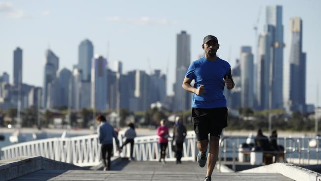 People are seen exercising at St Kilda Pier. Picture: NCA NewsWire / Daniel Pockett