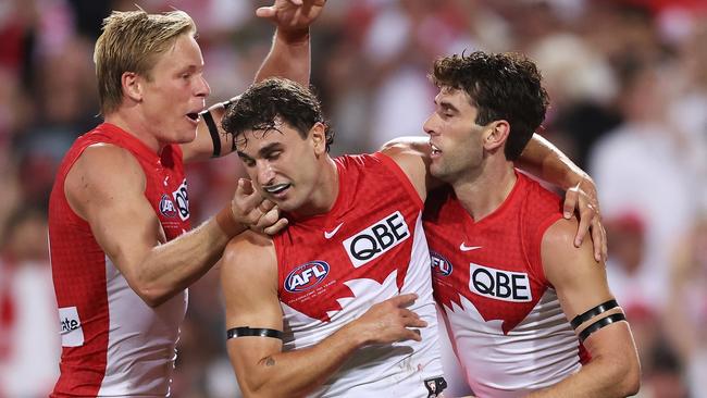 SYDNEY, AUSTRALIA - MARCH 07:  Robbie Fox of the Swans celebrates with team mates after kicking a goal during the Opening Round AFL match between Sydney Swans and Melbourne Demons at SCG, on March 07, 2024, in Sydney, Australia. (Photo by Matt King/AFL Photos/Getty Images)