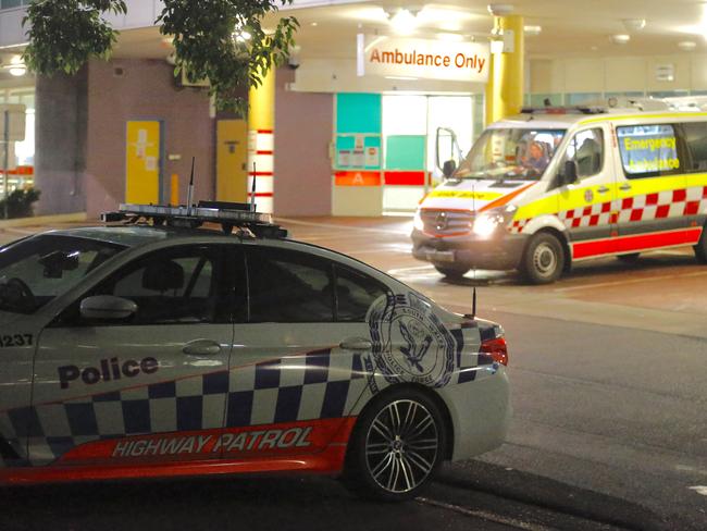 Police and ambulance paramedics at Liverpool hospital where a 20 year old male was taken for treatment of 2 gunshot wounds after self presenting to Bankstown hospital   Picture : Steve Tyson