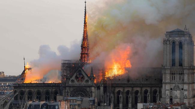 Smoke and flames billow from the roof of Notre-Dame on April 15, 2019. Picture: AFP