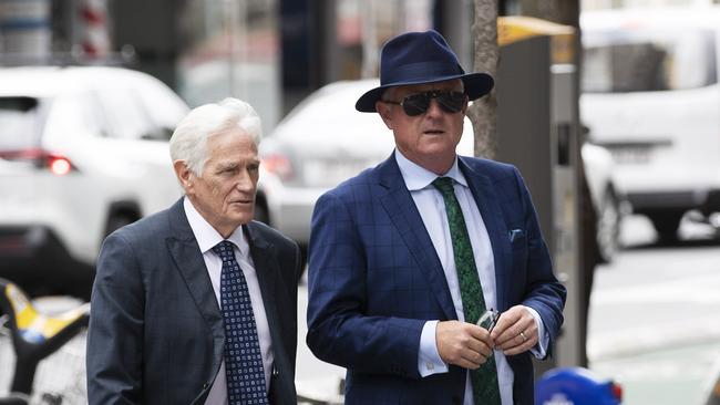 Former rich lister and property developer Craig Gore (R wearing hat) arrives with Defence Barrister Tony Glynn QC to Supreme Court in 2020. (News Corp/Attila Csaszar)