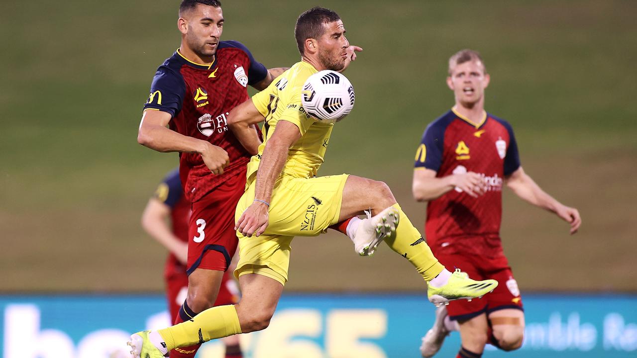 Alex Rufer, of the Wellington Phoenix leads the team out during