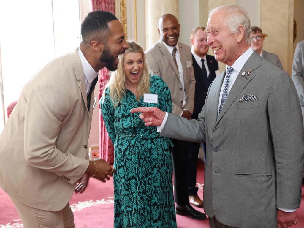 The King bursts into laughter after his fist bump. Picture: Getty Images