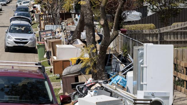 Home contents line the footpath in Oakland St Maribyrnong after the Maribyrnong river broke its banks and flooded nearby houses on Friday. Picture: David Geraghty