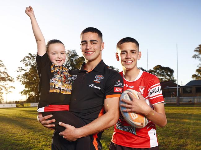 WEEKEND TELEGRAPH 16TH JUNE 2023Pictured at Waminda Oval in Campbelltown where he played rugby league as a junior is Wests Tigers player Tallyn Da Silva with his sister Peyton Da Silva and Kyle Da Silva. Tallyn makes his NRL debut against the Melbourne Storm tomorrow.Picture: Richard Dobson