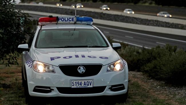 A police patrol near the Honeypot Rd overpass. Picture: DYLAN COKER