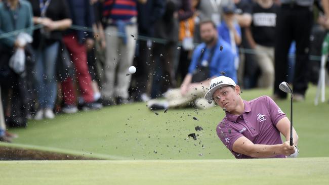 Cameron Smith hits out of a bunker during the World Cup of Golf.