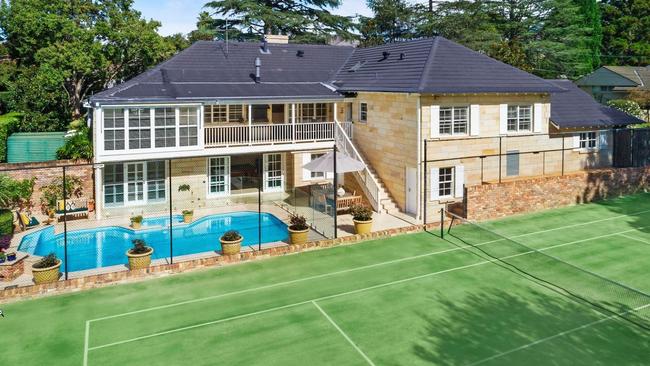 The stately home has a swimming pool and a tennis court.