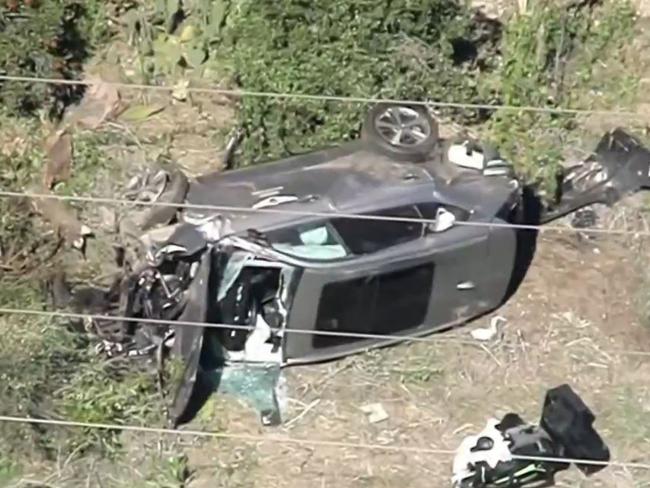 Aerial shots showed the horrific damage to Woods’ car.