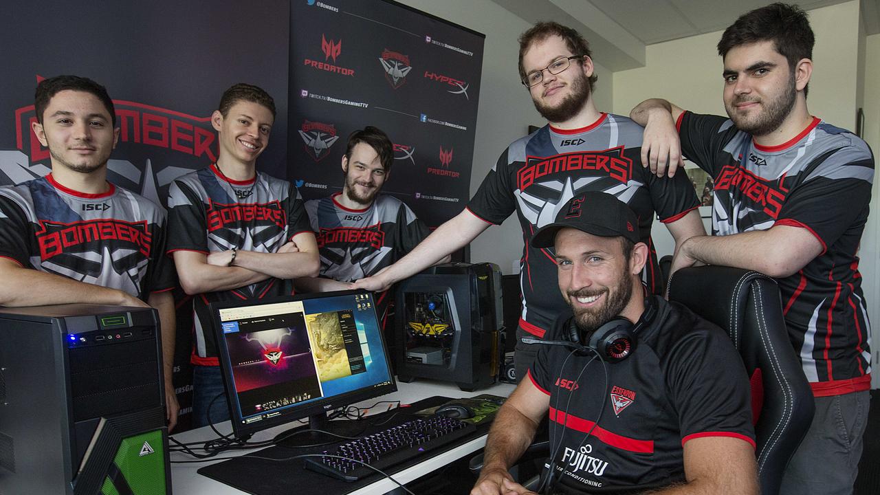Essendon’s Cale Hooker with the team’s esports players in 2018. Picture: Ian Currie